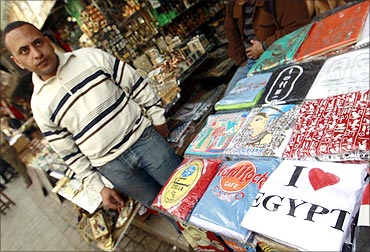 A street vendor stands outside of a store in the Khan al-Khalili area of Cairo.