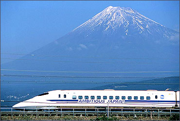 Japan's bullet train, or the shinkansen, speeds past Mount Fuji.