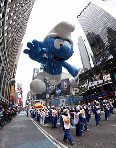 The Smurf balloon floats through Times Square.