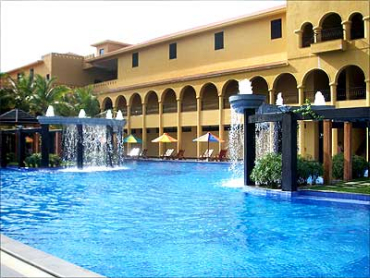 Infosys is working with the I-T department to manage the process. A view of the swimming pool at the Infosys campus.