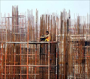 A labourer rests at the construction site of a residential complex on the outskirts of New Delhi.