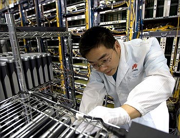 Huawei research staff performing routine maintenance.