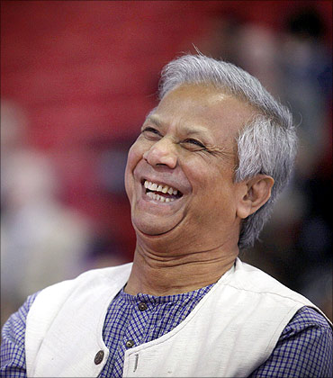 Muhammad Yunus listens at a Grameen America open house at St. John's University in New York.