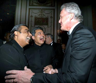 Rajat Gupta (center) and Mukesh Ambani share a joke with GE chairman Jeffrey Immelt.