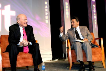 Gupta with former GE chairman Jack Welch (left).