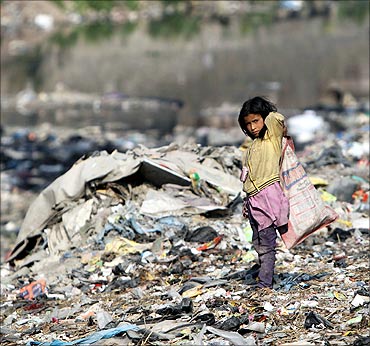 A child searches for recyclable material on the bank of Bagmati River in Kathmandu