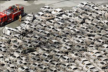 Burned-out cars are pictured at Hitachi Harbour in Ibaraki Prefecture.