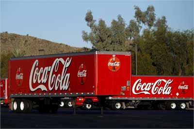 Coca Cola trailers sit parked outside the bottling company building in Tempe, Arizona.