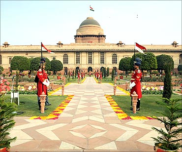 Guards stand in the Mughal gardens surrounding Rashtrapati Bhavan.