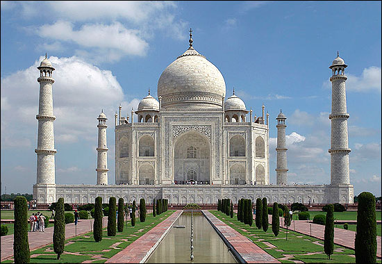 The Taj Mahal was built in Agra by Shah Jahan, a Mughal emperor, as a memorial to his deceased wife Mumtaz Mahal.