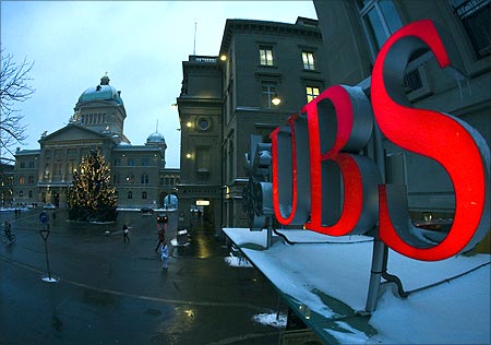 The logo of Swiss bank UBS is pictured in front of the Swiss Federal Palace in Bern.