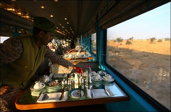 An attendant works inside Sheesh Mahal restaurant coach aboard a new luxury train on the outskirts of Jaisalmer.