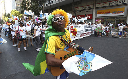 A man plays a guitar as he protests in downtown Rio de Janeiro against an oil reform amendment.