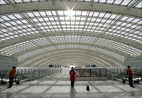 Airport staff at Beijing International Airport's new terminal.