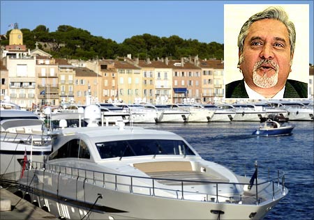 Docked luxury yachts are seen in Saint-Tropez harbour on the French Riviera. Vijay Mallya (inset).