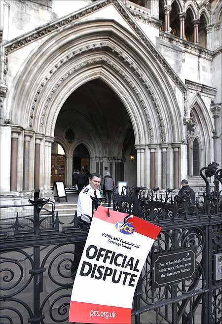 A placard is seen outside the High Court in central London.