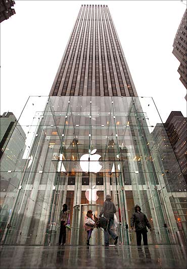 Customers enter the Fifth Avenue Apple store in New York.