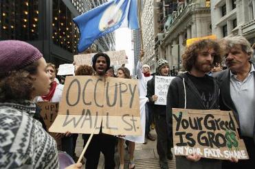 Members of the Occupy Wall Street movement take part in a protest march through the financial district of New York.