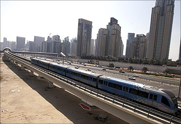 A Metro runs past Sheikh Zayed Road in Dubai.
