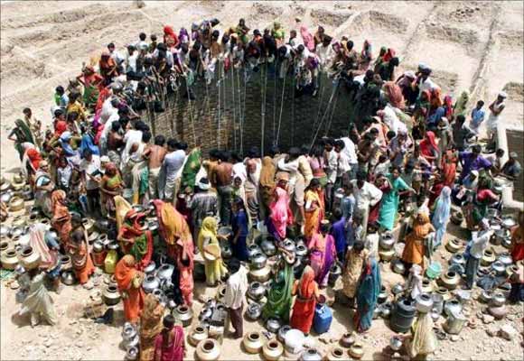 People gather to get water from a huge well in the village of Natwarghad in Gujarat.