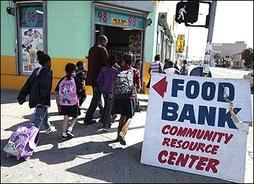Regional coordinator Charles Evans (4th L) picks up children from school to take them to an after-school program at South Los Angeles Learning Center in Los Angeles.