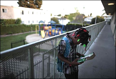 Jayla waits for her tutor to arrive at the shelter where she lives in Los Angeles.