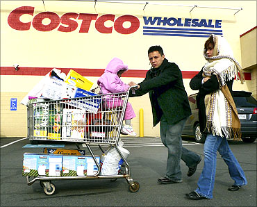 Shoppers leave Costco in Fairfax, Virginia.
