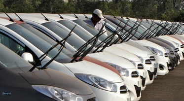Newly assembled Hyundai i10 cars are parked at a Hyundai plant in Sriperumbudur Taluk, Tamil Nadu.