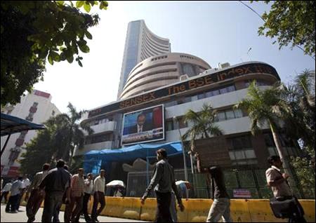 People walk outside the Bombay Stock Exchange building.