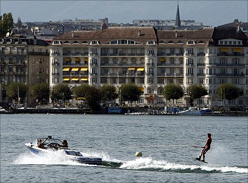 A wakeboarder performs on Lake Leman on a hot autumn day in Geneva.