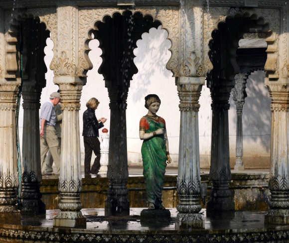 Tourists walk in 'Saheliyon-Ki-Badi' garden in Udaipur, Rajasthan. Saheliyon-Ki-Badi is an ornamental garden built by Sangram Singh II in 1710.