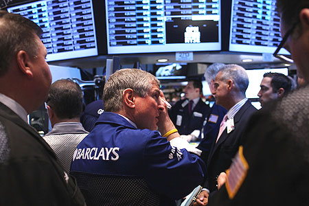 Traders work on the floor of the New York Stock Exchange.