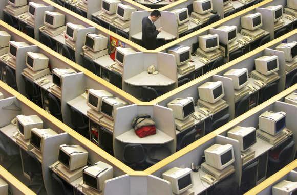 A man works in the trading room of Shanghai Stock Exchange.