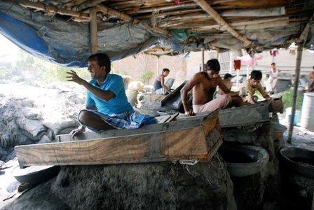 Workers at Bengal shanties are busy recovering gold from gold dust.