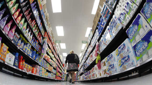 A shopper walks down an aisle in Walmart in Chicago.