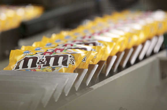 Packets of M&M's chocolates are seen at the production line of candy and chocolate maker Mars Chocolate France's plant in Haguenau.