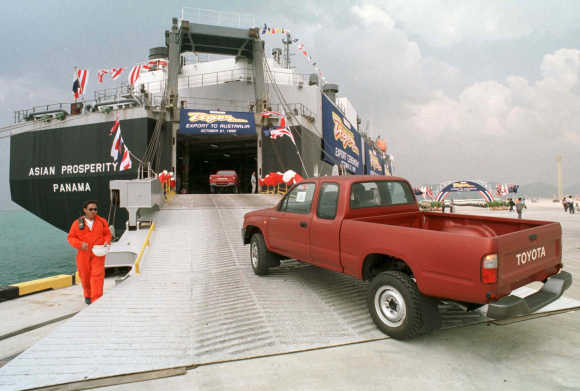 Toyota Hilux Tiger mini-trucks board a Panama-registered cargo ship at the deep-sea port of Laem Chabang on the Eastern seaboard of Thailand.