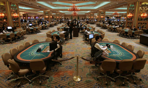 Employees prepare in the casino at the Venetian in Macau.