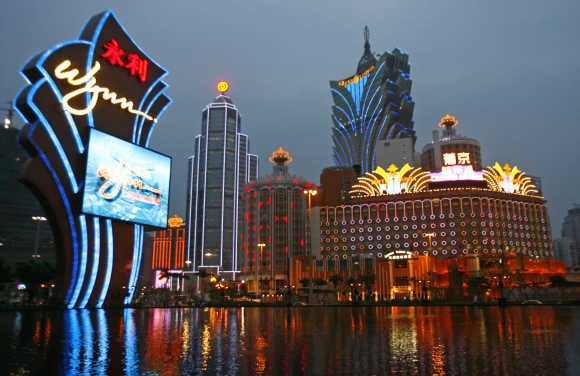 An evening view of Wynn Macau Casino, Casino Lisboa and Grand Lisboa Casino in Macau.