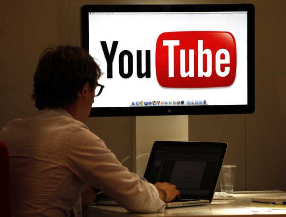 A visitor is seen at the YouTube stand in Cannes.