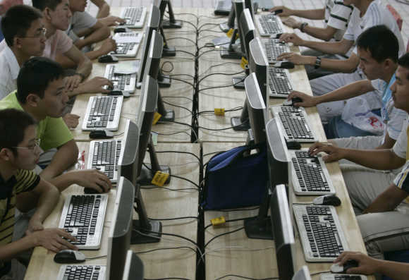 Customers use computers at an Internet cafe in Taiyuan, Shanxi province, China.
