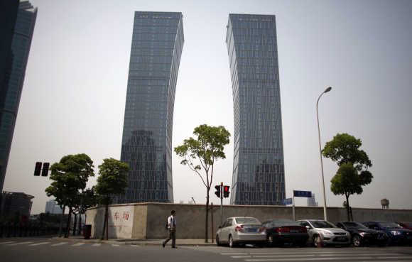 A man walks in Lujiazui financial district in Pudong, China.