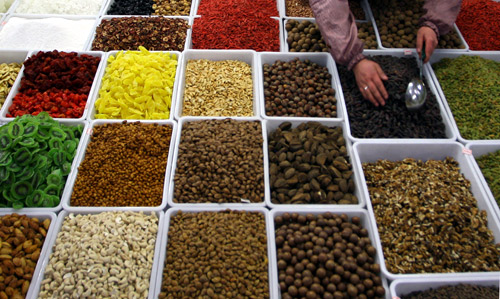 A vendor sells dry fruits and nuts at a market in Lanzhou, northwest China's Gansu province.