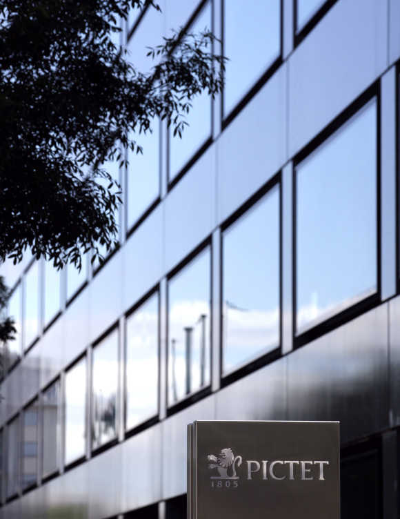A sign bearing the logo of family-owned private bank Pictet is pictured at company headquarters in Geneva.