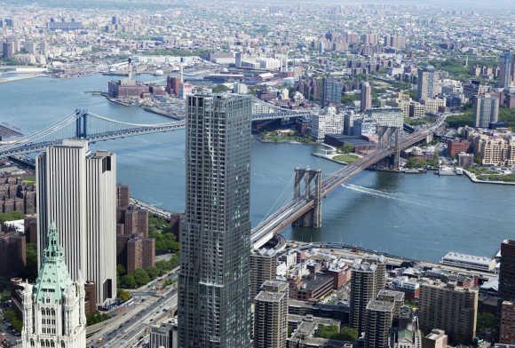 The Brooklyn Bridge and Manhattan Bridge is seen from the 90th storey of One World Trade Center in New York.