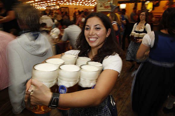 A waitress serves beer at the Oktoberfest in Munich.