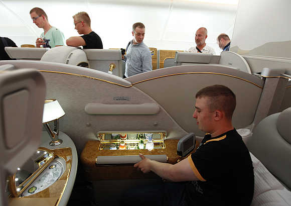 Visitors inspect the interior in First-Class section on board Airbus A380 passenger plane of Emirates Airline at ILA International Air Show in Schoenefeld outside Berlin, Germany.