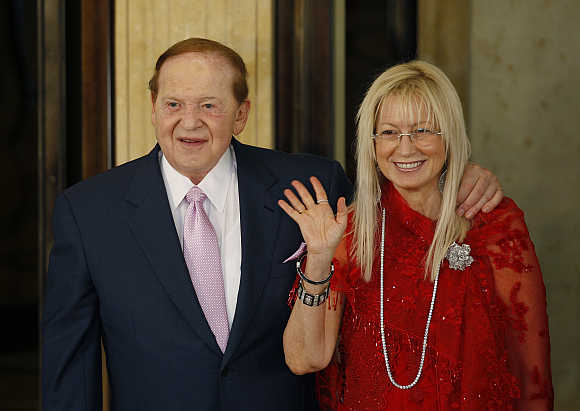 Sheldon Adelson with his wife Miriam attend the opening ceremony of the Four Seasons Macao hotel and casino in Macau.