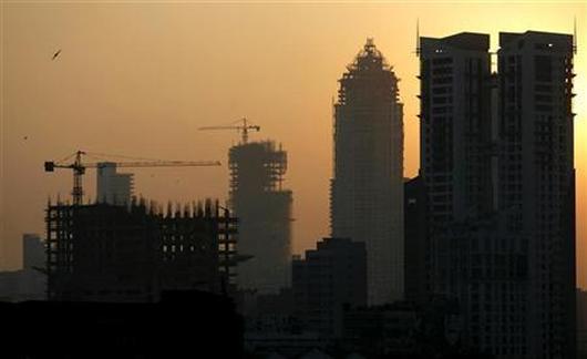 Buildings under construction are seen under the Mumbai skyline