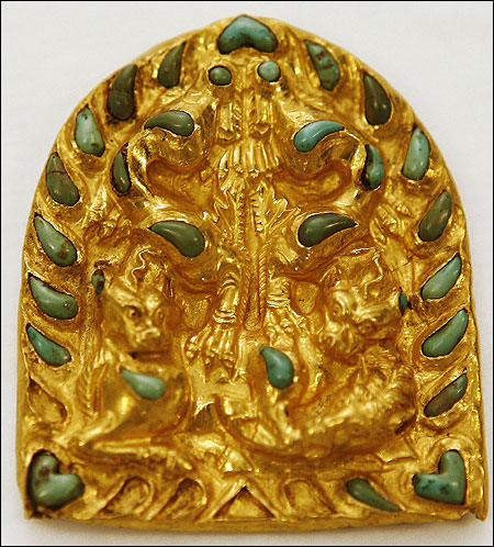 Gold and turquoise house plaque representing animals from the first century, discovered in 1978 on the archeological site of Tillia Tepe (northern Afghanistan).